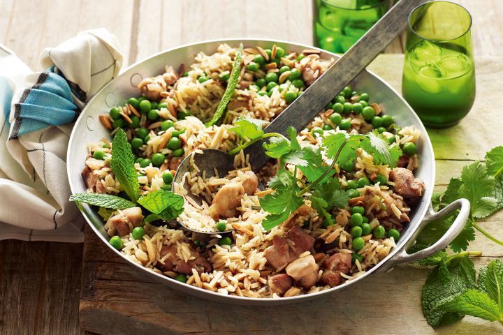 Cooking Meat Almond, pea and coriander pilaf with chicken