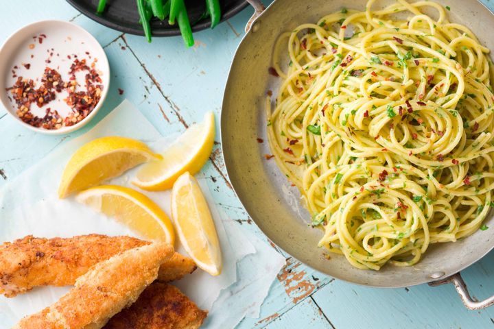 Cooking Meat Almond crumbed chicken schnitzel with herb buttered spaghetti