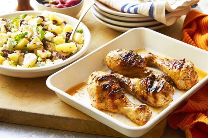 Cooking Meat Barbecued yoghurt-marinated drumsticks with warm Greek potato salad