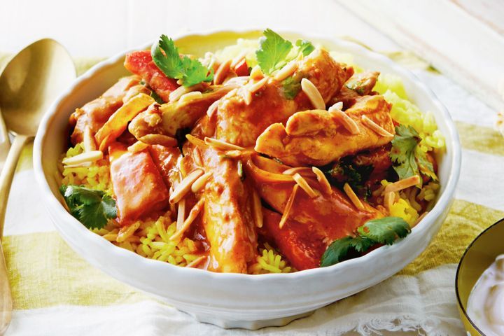 Cooking Meat Butter chicken with turmeric rice