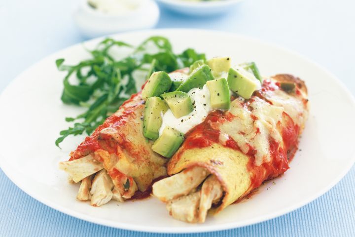 Cooking Meat Chicken enchiladas with beans