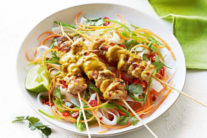 Cooking Meat Chicken satay skewers with spicy noodle salad
