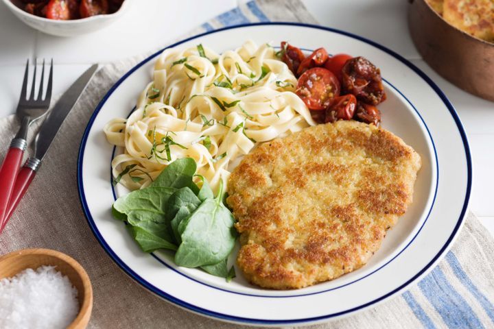 Cooking Meat Chicken schnitzel with garlic pappardelle and tomato chutney