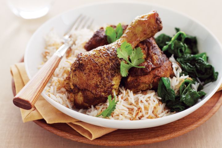 Cooking Meat Indian-spiced chicken with coconut rice