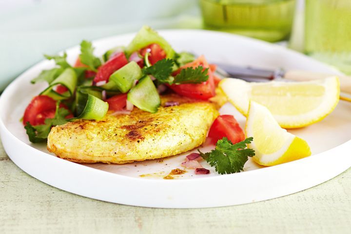 Cooking Meat Low-fat Indian-spiced chicken with tomato salad