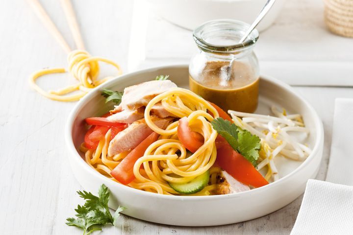 Cooking Meat Noodle salad with warm satay dressing