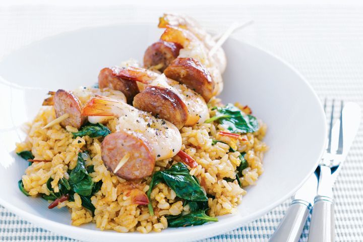 Cooking Meat Prawn and chorizo skewers with spinach rice pilaf