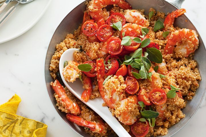 Cooking Meat Quinoa risotto with prawns, oregano and tomatoes