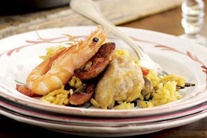 Cooking Meat Saffron chicken, prawn & chorizo paella