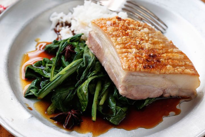Cooking Meat Slow-cooked pork belly on braised Asian greens