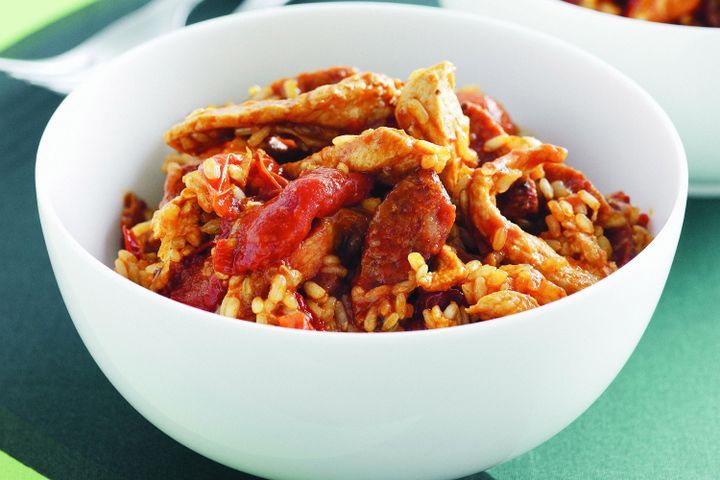 Cooking Meat Spanish-style rice with chicken and chorizo