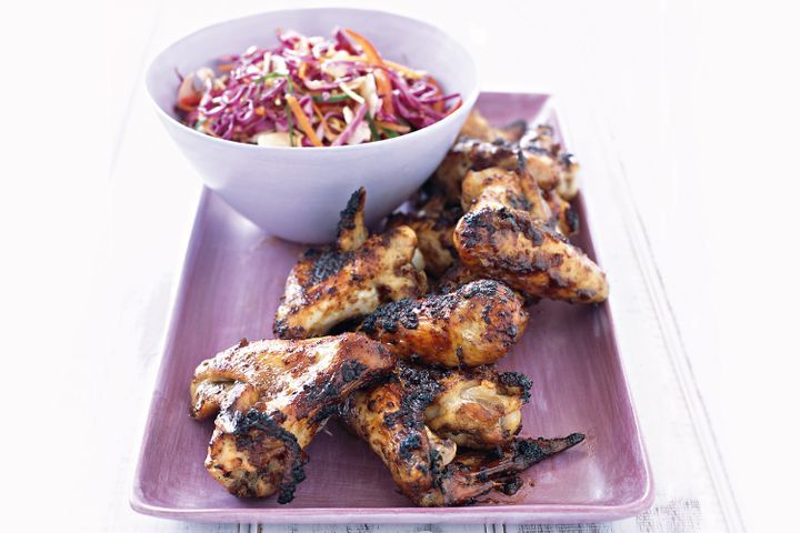 Cooking Meat Spicy wings with Asian coleslaw