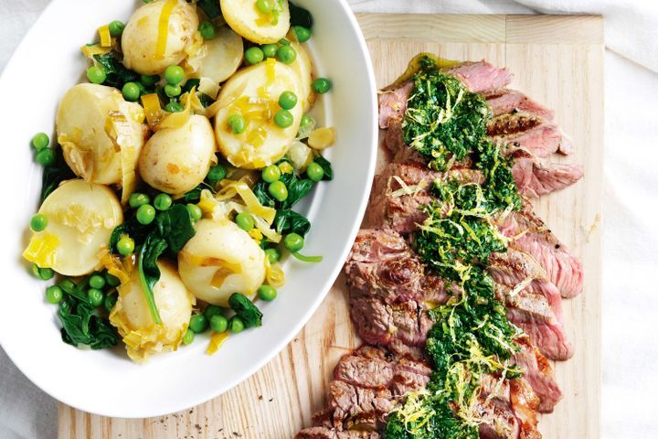 Cooking Meat Steak with salsa verde, braised potatoes and peas