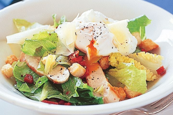 Cooking Eggs Chicken Caesar salad with poached egg