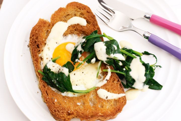 Cooking Eggs Eggs in bread with wilted spinach and hollandaise