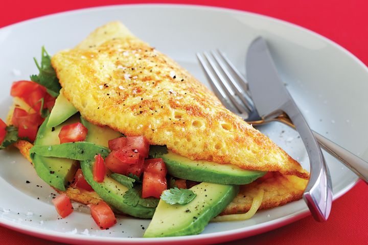 Cooking Eggs Tomato, cheese and avocado omelette