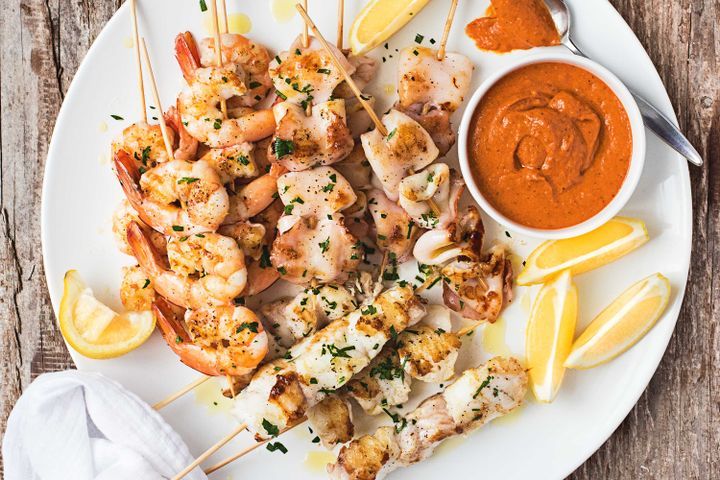 Cooking Fish BBQ seafood skewers with romesco sauce