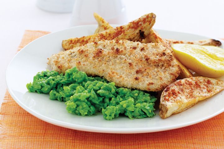Cooking Fish Crisp fish with green pea mash and potato wedges