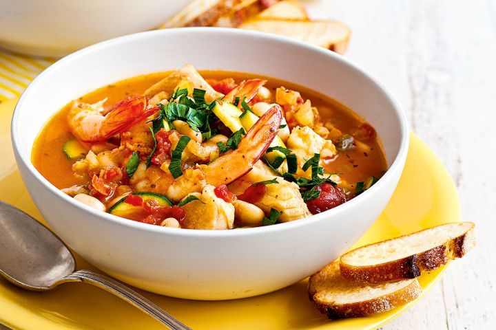 Cooking Fish Italian seafood soup with garlic croutons