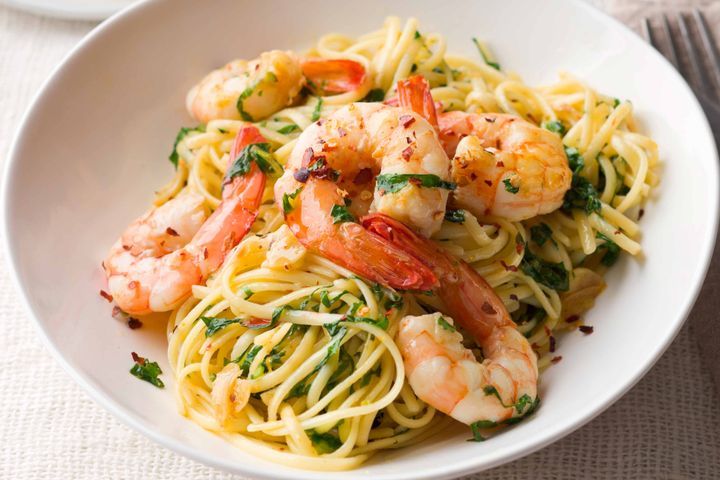 Cooking Fish Linguine with prawns, chilli, garlic & rocket