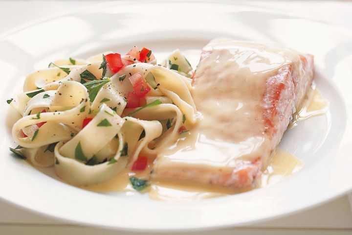 Cooking Fish Poached salmon with beurre blanc sauce and fettuccine