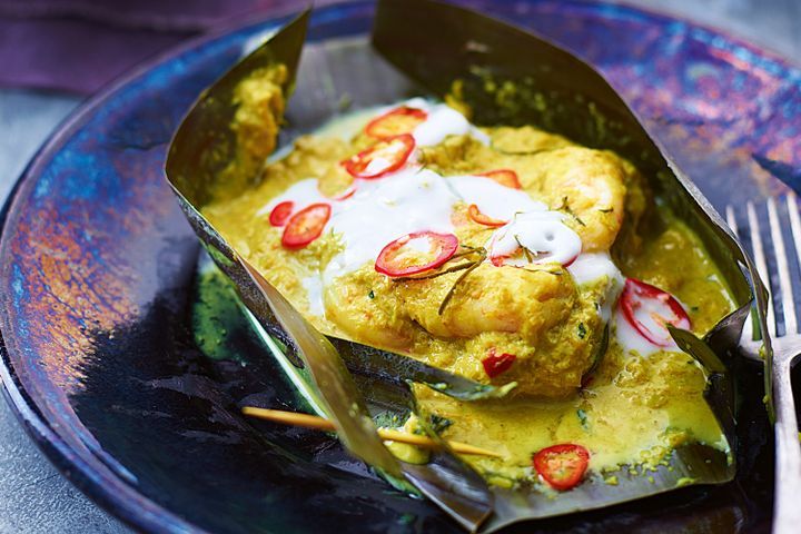 Cooking Fish Seafood amok (Traditional Cambodian seafood curry)