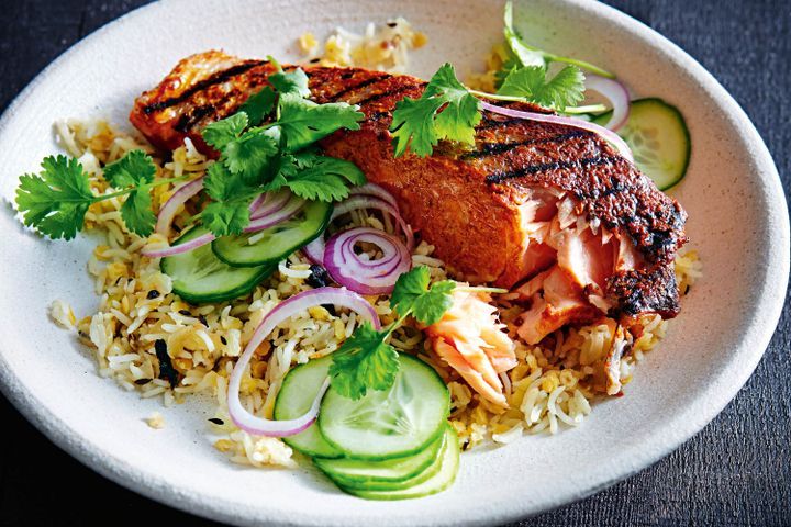 Cooking Fish Tandoori salmon with rice and lentil pilaf