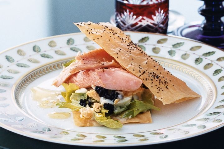 Cooking Fish Trout with egg, celery and caviar sauce and poppyseed crisps