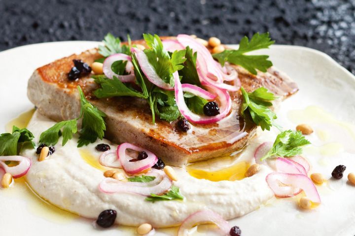 Cooking Fish Tuna steaks with white bean puree and currant and pine nut salad