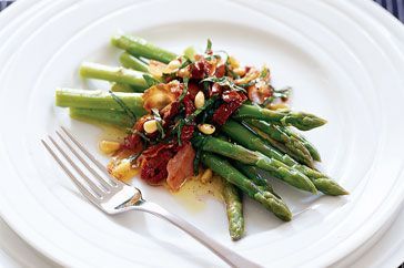 Cooking Meat Asparagus with sun-dried tomatoes and basil