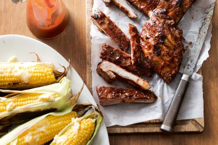 Cooking Meat Barbecued pork ribs with grilled corn and parmesan butter