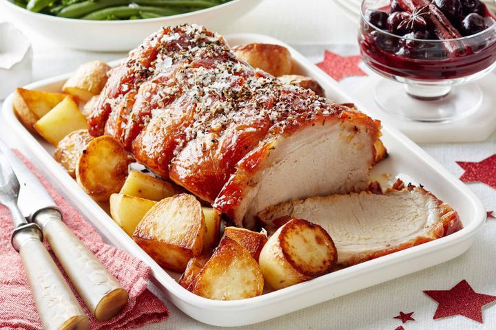 Cooking Meat Crispy Christmas roast pork with spiced cherry port sauce