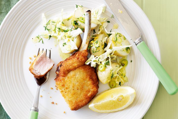 Cooking Meat Crumbed pork cutlets with potato & cabbage salad