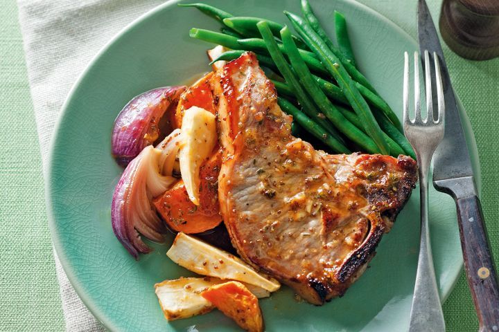 Cooking Meat Glazed orange pork with sweet potato and parsnip