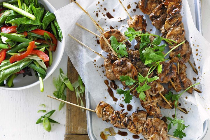 Cooking Meat Glazed pork skewers with stir-fried vegetables