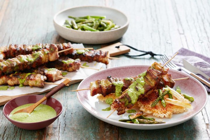 Cooking Meat Green curry pork skewers with asparagus and crispy rice