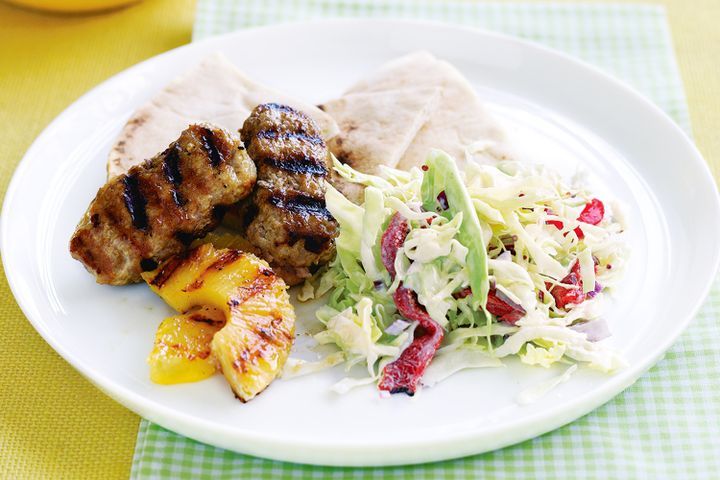 Cooking Meat Grilled ginger pork sausages and cabbage salad