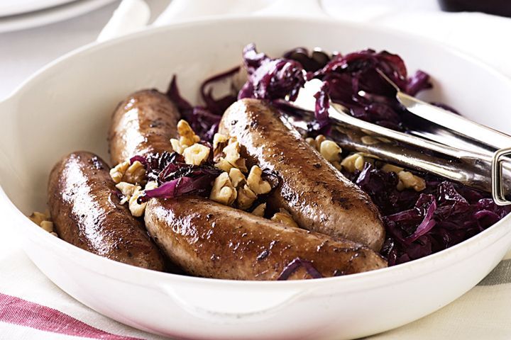 Cooking Meat Honey and orange sauteed red cabbage with pork bangers