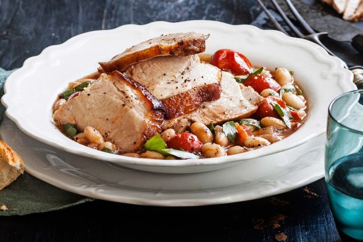 Cooking Meat Italian-style slow roast pork with beans