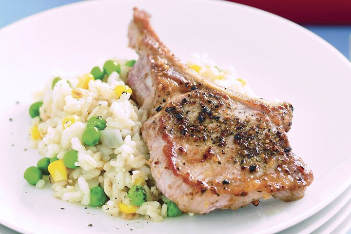 Cooking Meat Italian pork cutlets with corn and pea risotto
