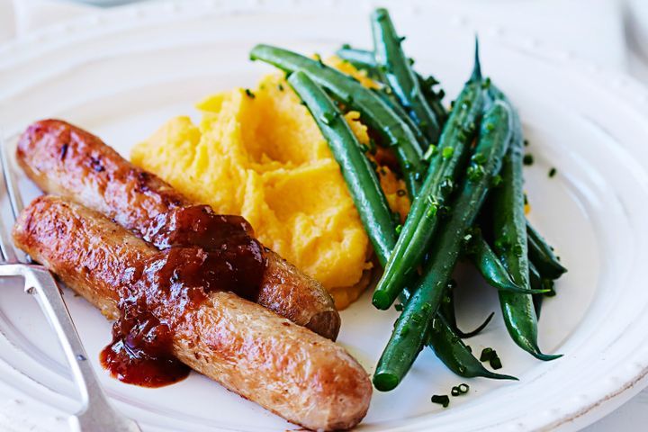 Cooking Meat Italian sausages with pumpkin and potato mash