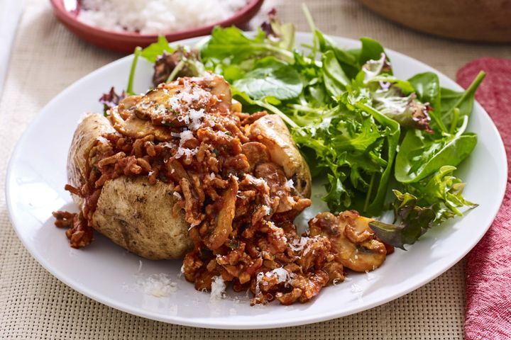 Cooking Meat Jacket potatoes with pork and mushroom ragu