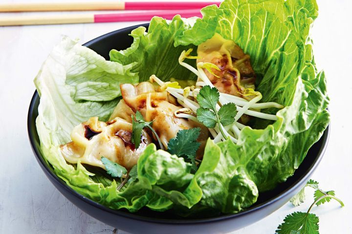 Cooking Meat Justines pork pot stickers in lettuce cups