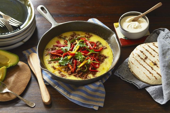 Cooking Meat Molten cheese with fire-roasted chillies and Mexican chorizo