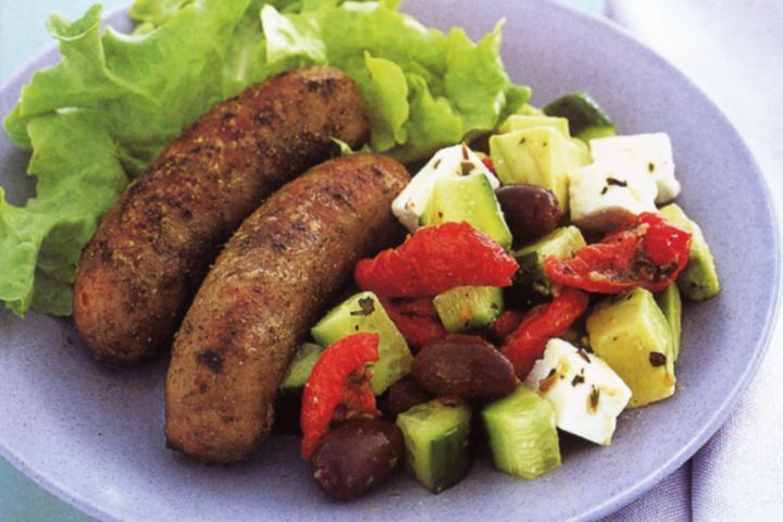 Cooking Meat Oregano pork sausages with Greek salad