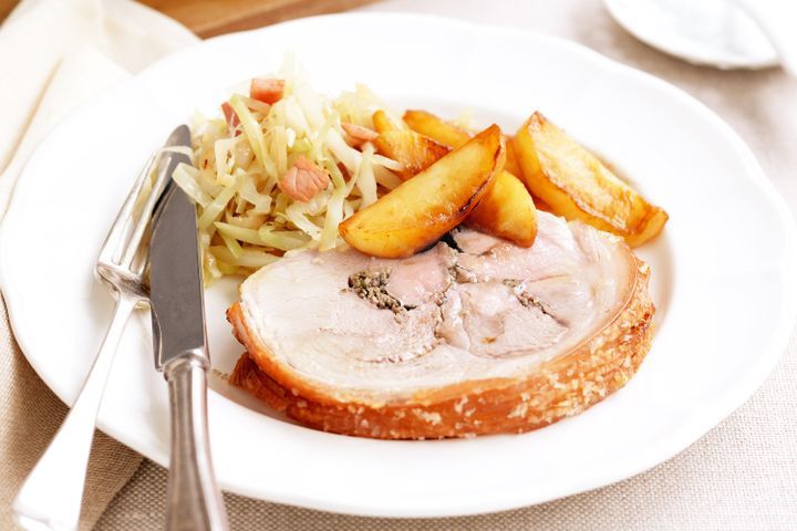 Cooking Meat Pan-fried cider and caraway pork with cabbage and apples