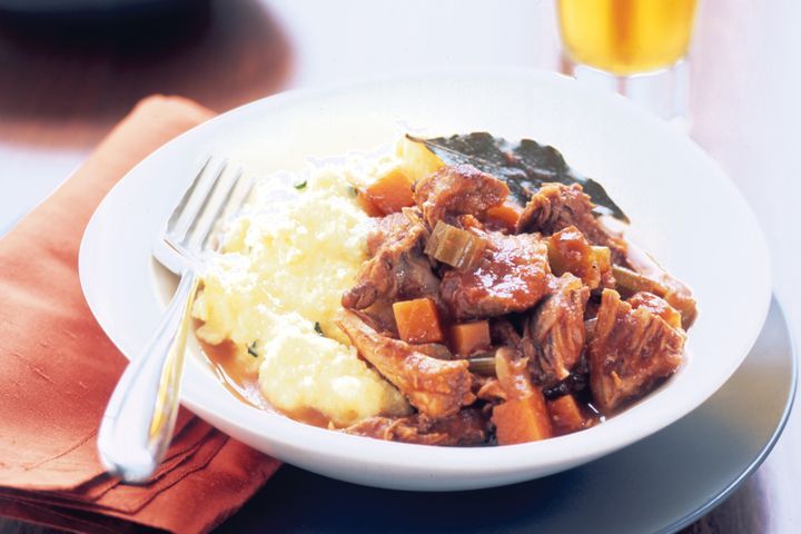 Cooking Meat Pork ragu with creamy sage polenta