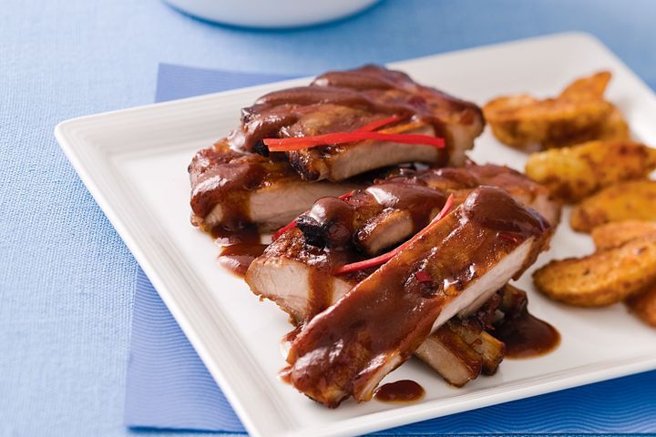 Cooking Meat Pork ribs with smoky barbecue sauce