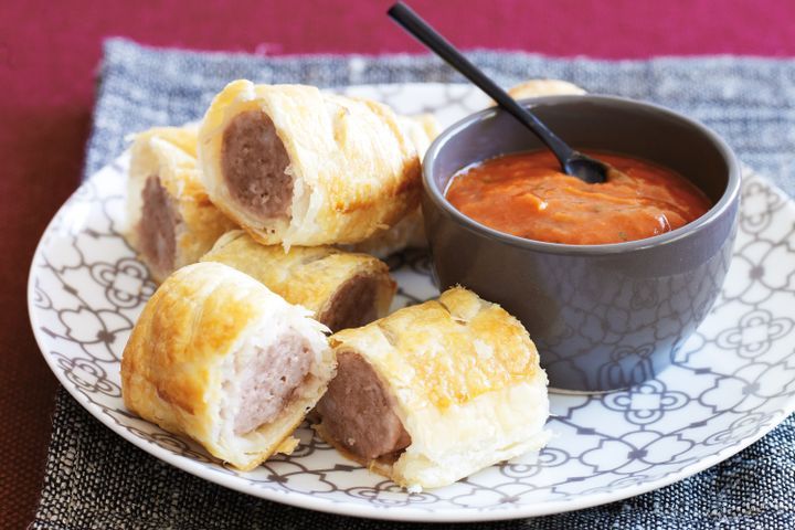 Cooking Meat Pork sausage rolls with basil tomato sauce