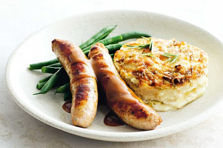 Cooking Meat Pork sausages with cabbage and gruyere gratin